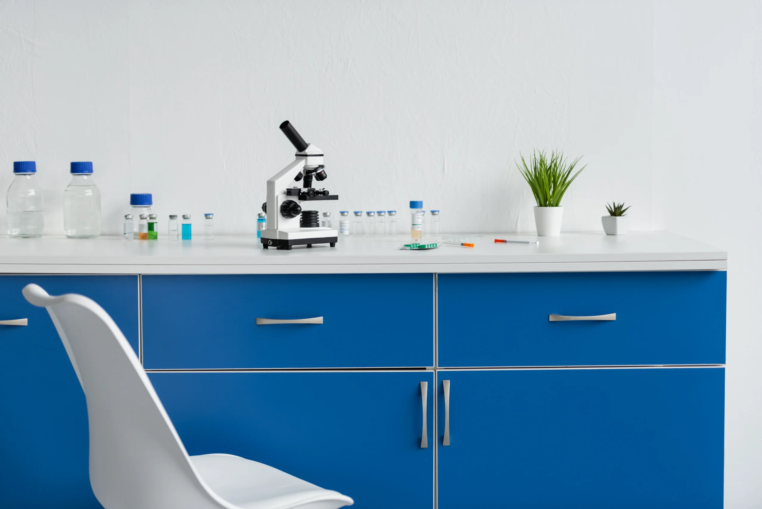 microscope-and-vaccines-on-table-in-laboratory-2026-03-11-03-21-46-utc